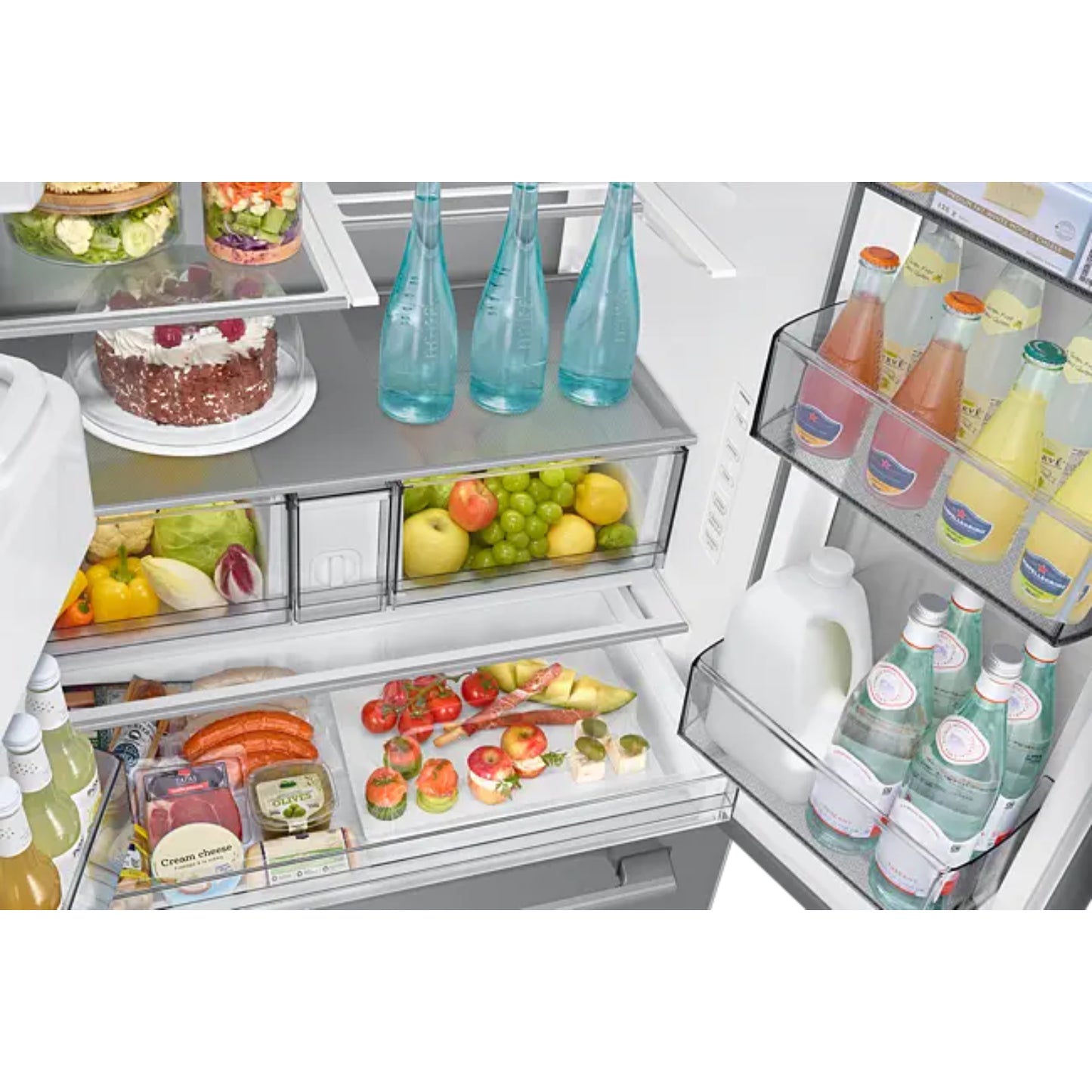 Refrigeradora Samsung interior con frutas, verduras y bebidas visibles