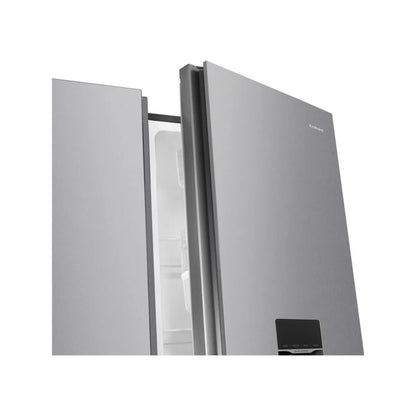 Refrigeradora moderna con dispensador de agua FRIGIDAIRE con puertas de acero inoxidable y elegante diseño.