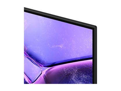 Pantalla del televisor Samsung 85 pulgadas 4K mostrando un colorido fondo violeta brillante