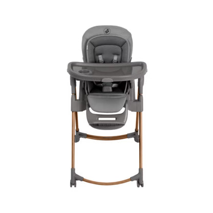 Silla alta gris de MAXI COSI vista frontal en un ambiente moderno