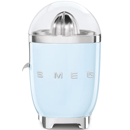 Exprimidor SMEG azul, frontal con tapa transparente, cocina moderna