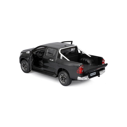 Modelo Hilux negro, vista trasera, detalle de cabina y caja